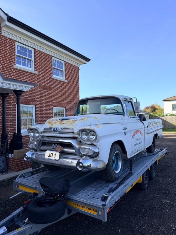 Classic GMC pickup loaded on the trailer