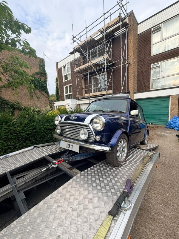 Classic Mini being winched onto the truck