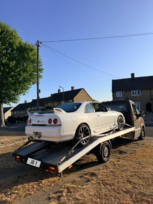 Nissan Skyline strapped down on the recovery truck