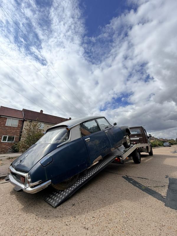 Classic Citroën DS being winched onto the recovery truck